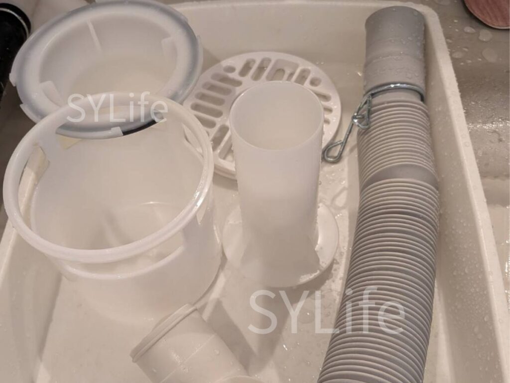 足立区　ドラム式洗濯機クリーニング　NA-LX127AL排水口洗浄後の写真。